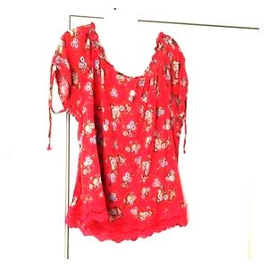 Red floral blouse with ruffled neckline and ties